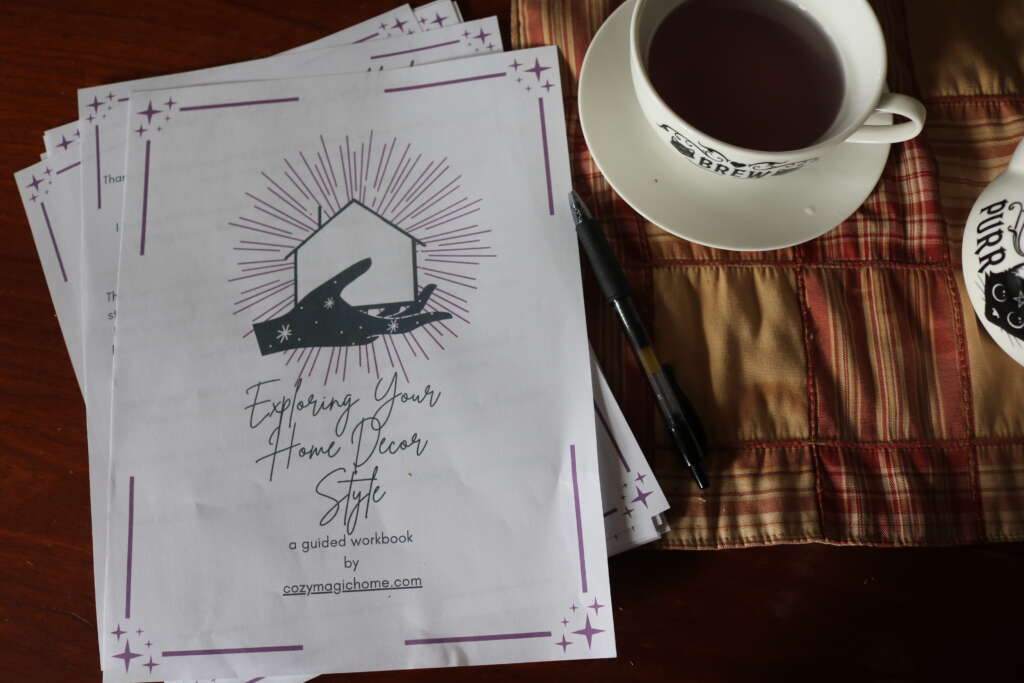 home decor free printable workbook on desk with cup of tea
