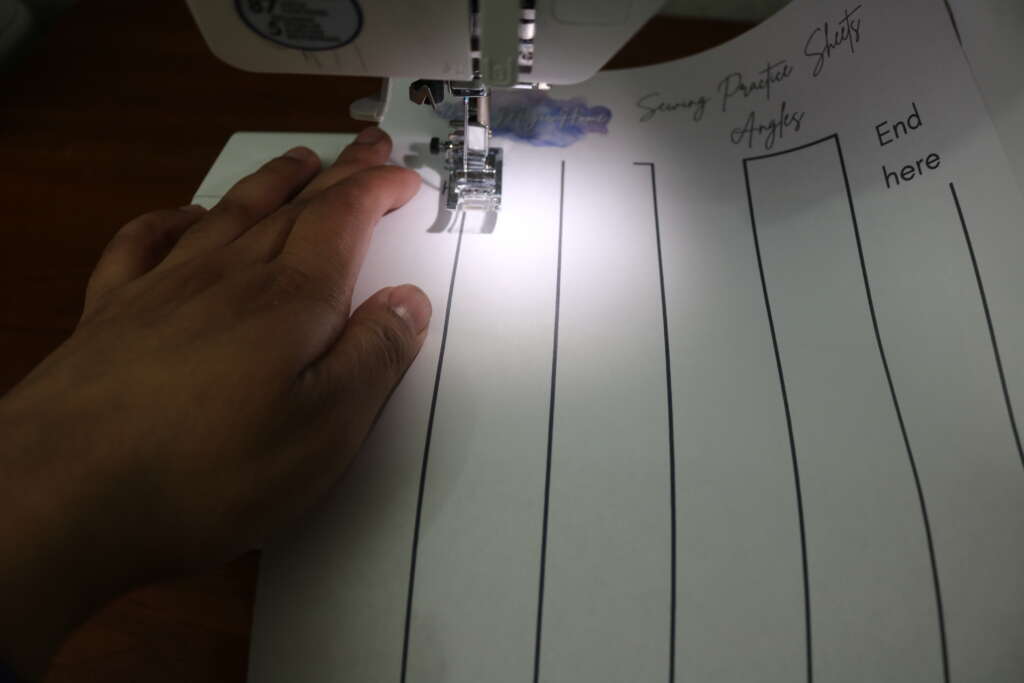 sewing practice sheets - inserting paper under presser foor