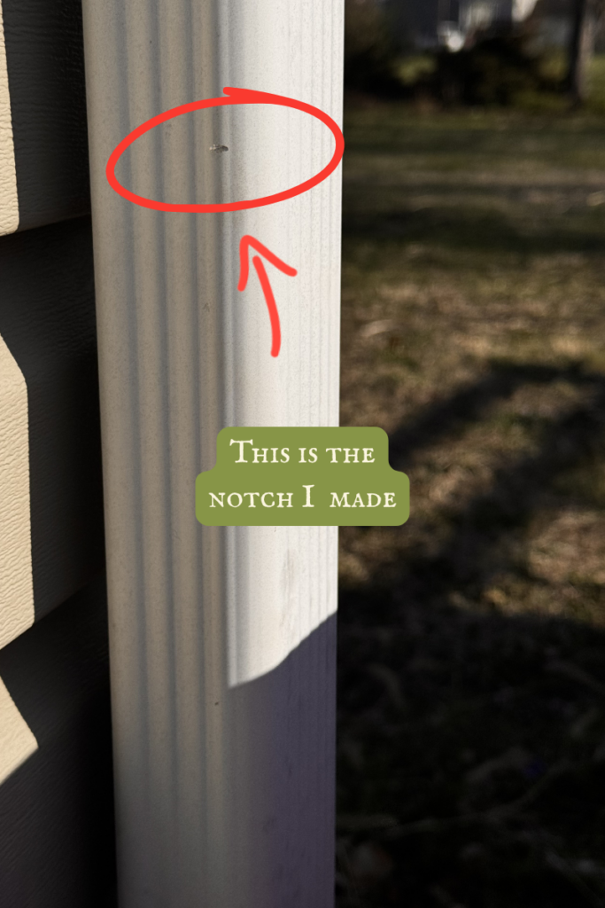 A Quick Guide to Installing a Rain Barrel - notch on where to cut on downspout pipe
