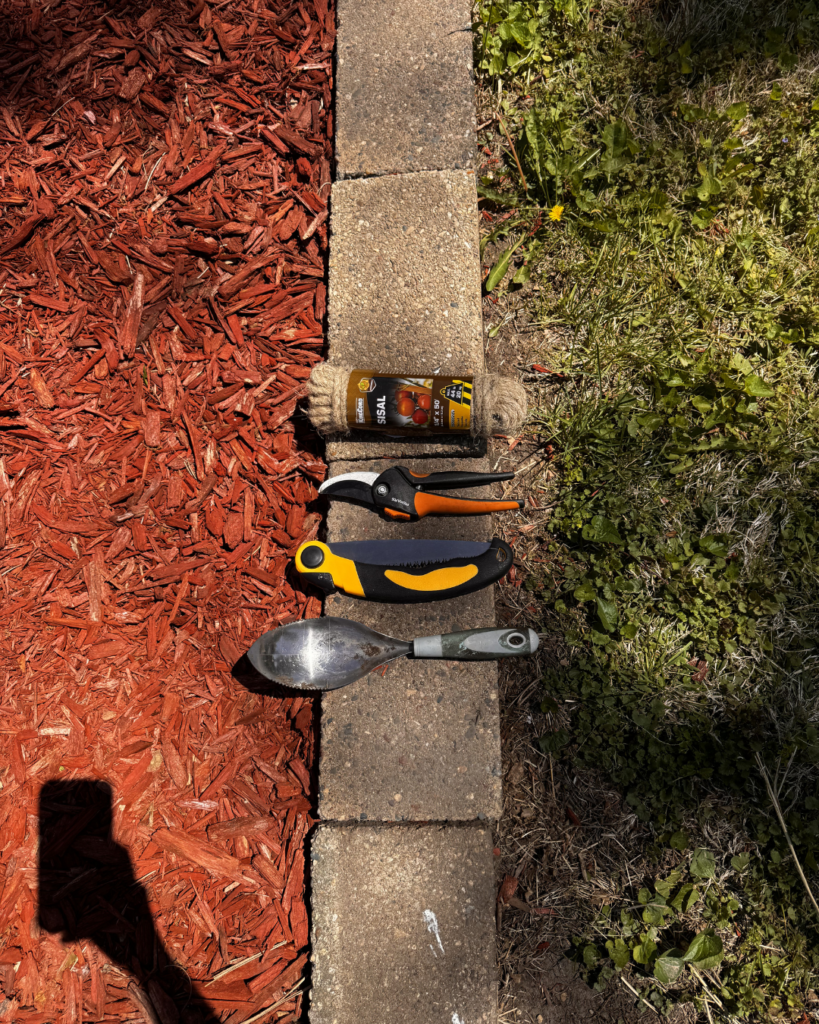 Vertical Pumpkin Gardening -  some tools used for project, serrated trowel, foldable tree saw, clippers, sisal rope