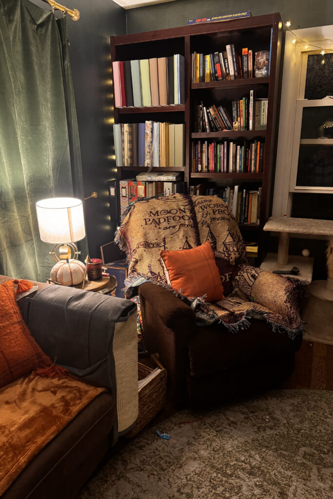 Innkeeping - cozy corner with books and lighting and sofa