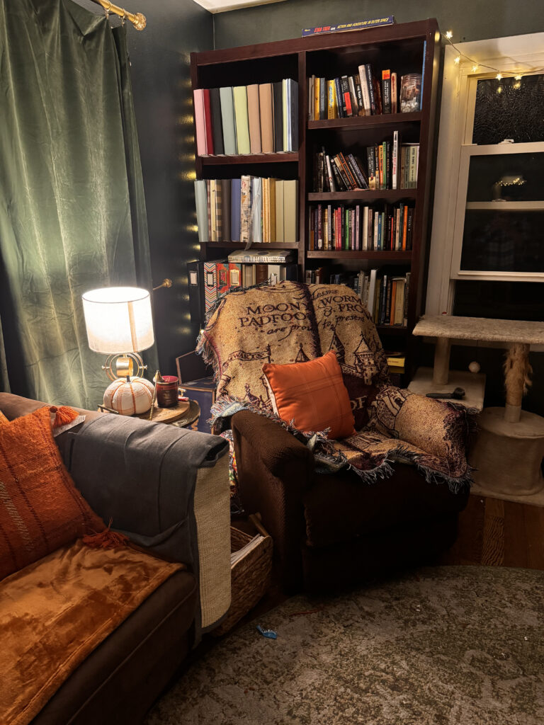 Cozy reading chair with fairy lights and warm lamps in a peaceful home sanctuary