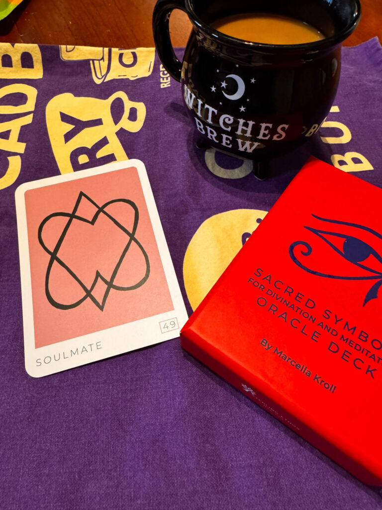 Coffee, and oracle cards on a tea towel