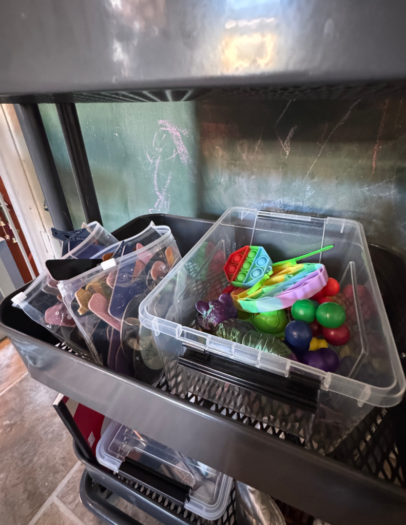 Rolling cart shelf with magnets and fidget toys